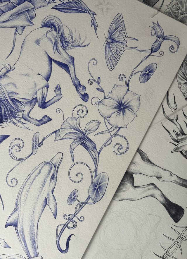 Blue ballpoint flash sheet — a galloping horse, a moth, morning glories and a dolphin.