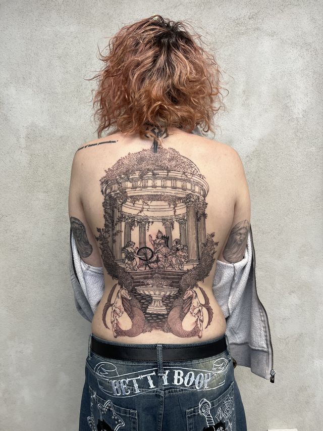 Full-back piece of a classical gazebo with figures inside, flanked by two mermaids.
