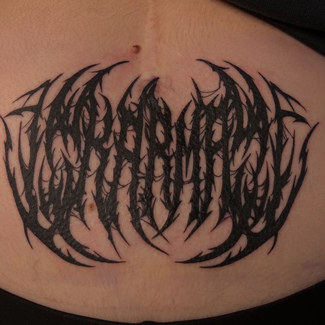 Death-metal style lettering logo across the stomach.